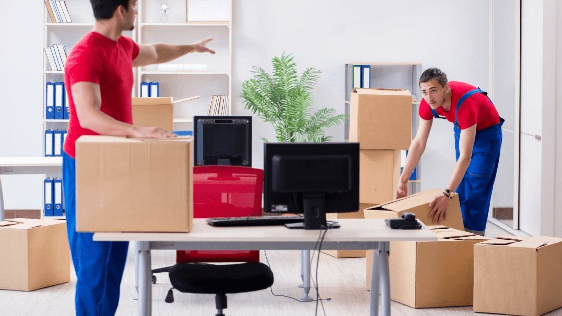 Comparing Rent a U-Haul vs Moving Companies in Ottawa 5 Two movers packing boxes