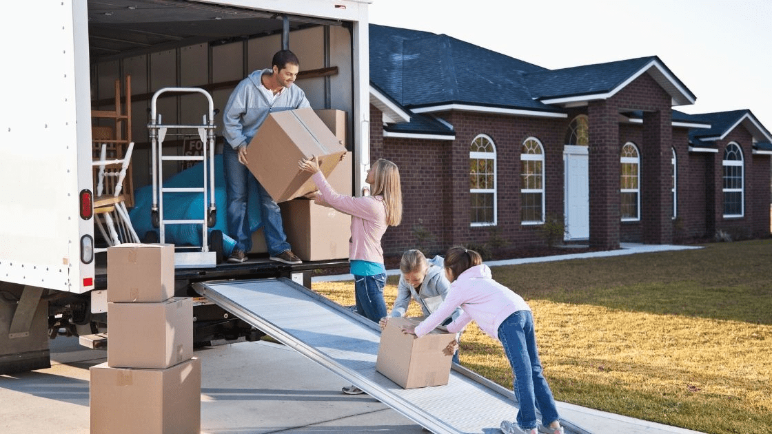Comparing Rent a U-Haul vs Moving Companies in Ottawa 1 A family loading a U-Haul truck for a long distance move