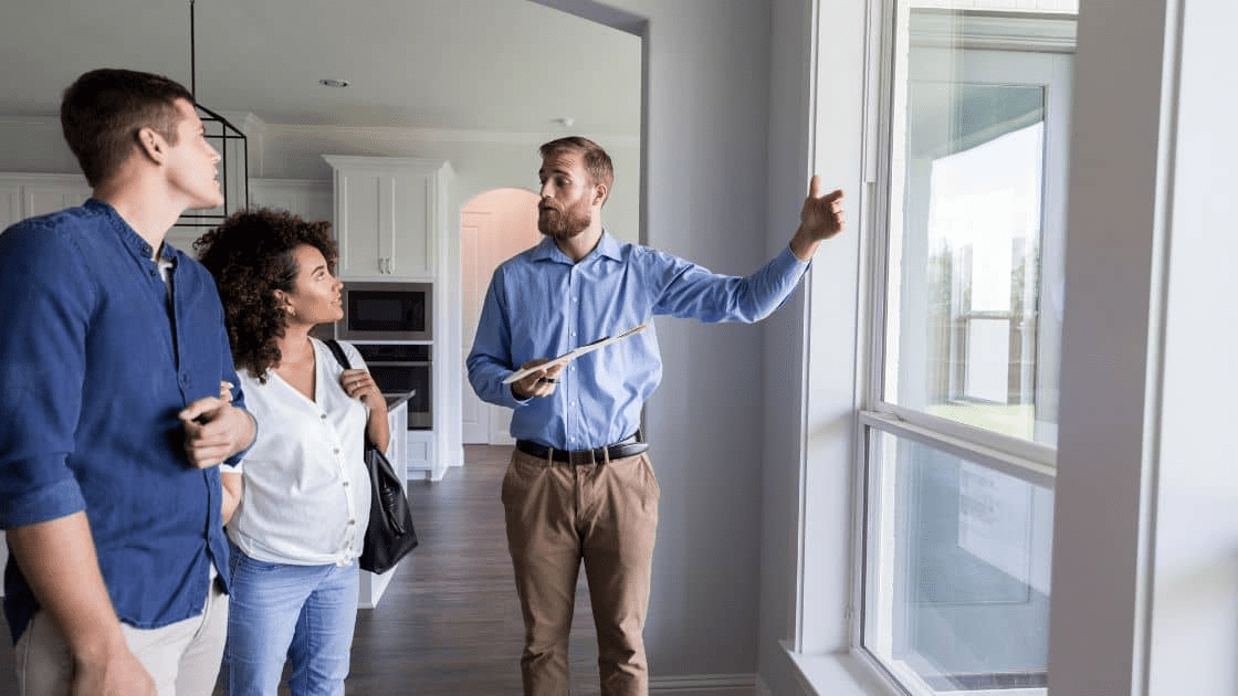 How to Plan a Successful Moving and Renovating Project 4 A real estate agent showing a house to a family