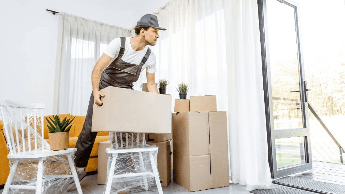 How to Plan a Successful Moving and Renovating Project 2 A professional moving crew carrying boxes and furniture out of a house