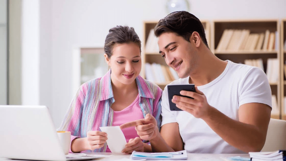 How to Plan a Successful Moving and Renovating Project 3 A family discussing their budget for a new house